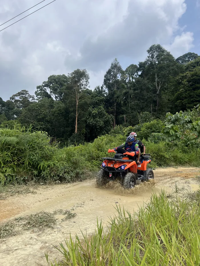 ATV trail riding through the jungle